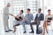 Photo: Director welcoming businesswoman Director welcoming businesswoman