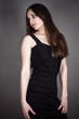beautiful brunette in a black dress