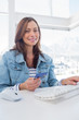 Pretty woman purchasing online with her credit card