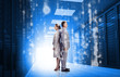 Business people standing back to back in data center
