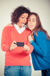 Photo: Two Beautiful Women Taking Self Portrait with Mobile Phone Two Beautiful Women Taking Self Portrait with Mobile Phone