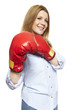 Young woman wearing boxing gloves smiling
