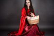 attractive woman sitting with a basket in hand