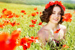 Young girl  in poppies field