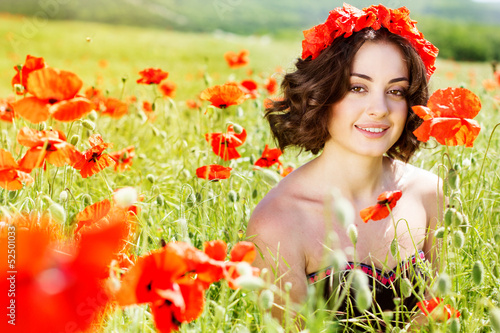 Photo: Young girl in poppies field Young girl in poppies field