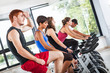 Group of People Cycling at Gym