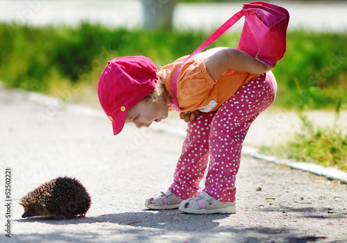 Photo: girl and hedgehog girl and hedgehog