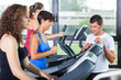 People Running on Treadmill in the Gym