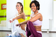 women in the gym doing yoga exercise for fitness
