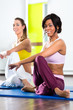 women in the gym doing yoga exercise for fitness