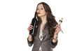 nice woman smells the wine from the bottle