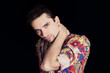 Photo: Stylish young man on a black background Stylish young man on a black background