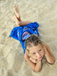 pretty young girl lying on the beach