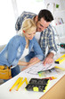 Photo: Couple designing home interior project Couple designing home interior project