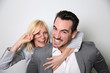 Cheerful trendy couple having fun