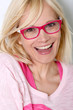 Beautiful young woman wearing pink glasses