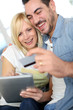 Couple shopping on internet with credit card