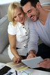 Photo: Couple working on home remodellng Couple working on home remodellng