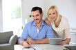 Middle-aged Couple Working Fro...