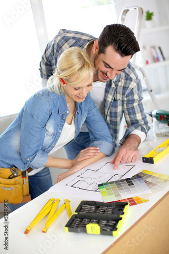 Photo: Couple designing home interior project Couple designing home interior project