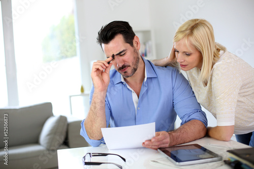 Photo: Middle-aged couple working from home Middle-aged couple working from home