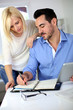 Middle-aged couple working from home