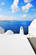 Typical architecture with stunning view over the caldera in Oia