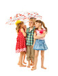 Foto: Barefoot children under an umbrella Barefoot children under an umbrella