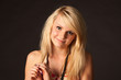 Beautiful blonde girl posing in studio