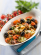 Photo: squid with tomatoes olives and capers, selective focus squid with tomatoes olives and capers, selective focus