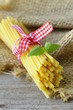 Photo: Italian still life - pasta on a wooden table Italian still life - pasta on a wooden table