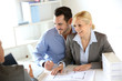 Couple meeting construction planner