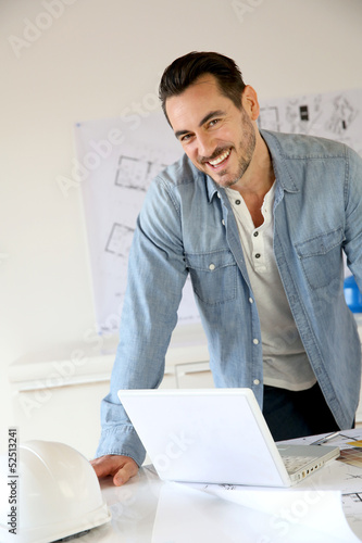 Photo: Portrait of architect working on project Portrait of architect working on project