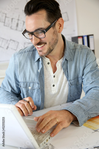 Photo: Portrait of architect working on project Portrait of architect working on project