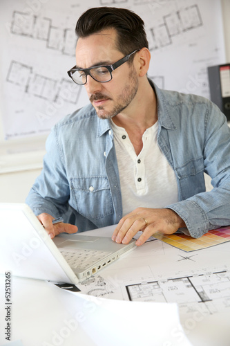 Photo: Portrait of architect working on project Portrait of architect working on project