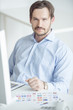 Handsome businessman sitting at the desk