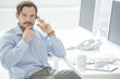Photo: Close up of businessman talking mobile phone Close up of businessman talking mobile phone