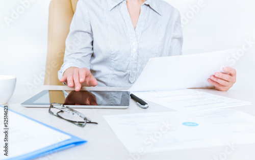 Photo: Business person working with documents Business person working with documents