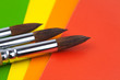 Paintbrush on colorful background