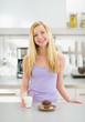 Happy teenager girl with glass of milk and chocolate muffin 