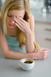 Portrait of young woman drinking coffee in the morning