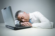 Foto: Mature businessman sleeping Mature businessman sleeping