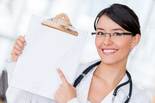 Photo: Doctor pointing at a prescription Doctor pointing at a prescription