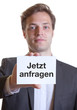 Foto: Junger Mann im Anzug mit Karte JETZT ANFRAGEN Junger Mann im Anzug mit Karte JETZT ANFRAGEN