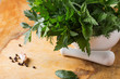 Fresh organic herbs on wooden table