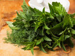 Fresh organic herbs on wooden table