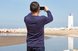Man Photographing Lighthouse