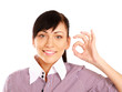 Portrait of a beautiful young woman showing ok