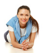 Photo: Portrait of a smiling young woman lying on the floor Portrait of a smiling young woman lying on the floor