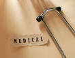 A word medical written on a ripped piece
